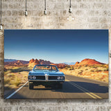 Man driving vintage car through desert Canvas Prints Wall Art - Painting Canvas, Wall Decor, Home Decor, Prints for Sale