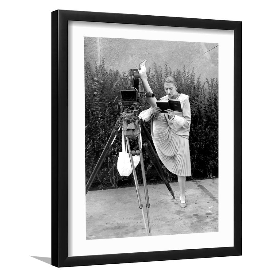 Woman Reading Black And White Print, Kicking Leg Up On Camera Reading A Book Framed Art Prints Wall Art Decor, White Border